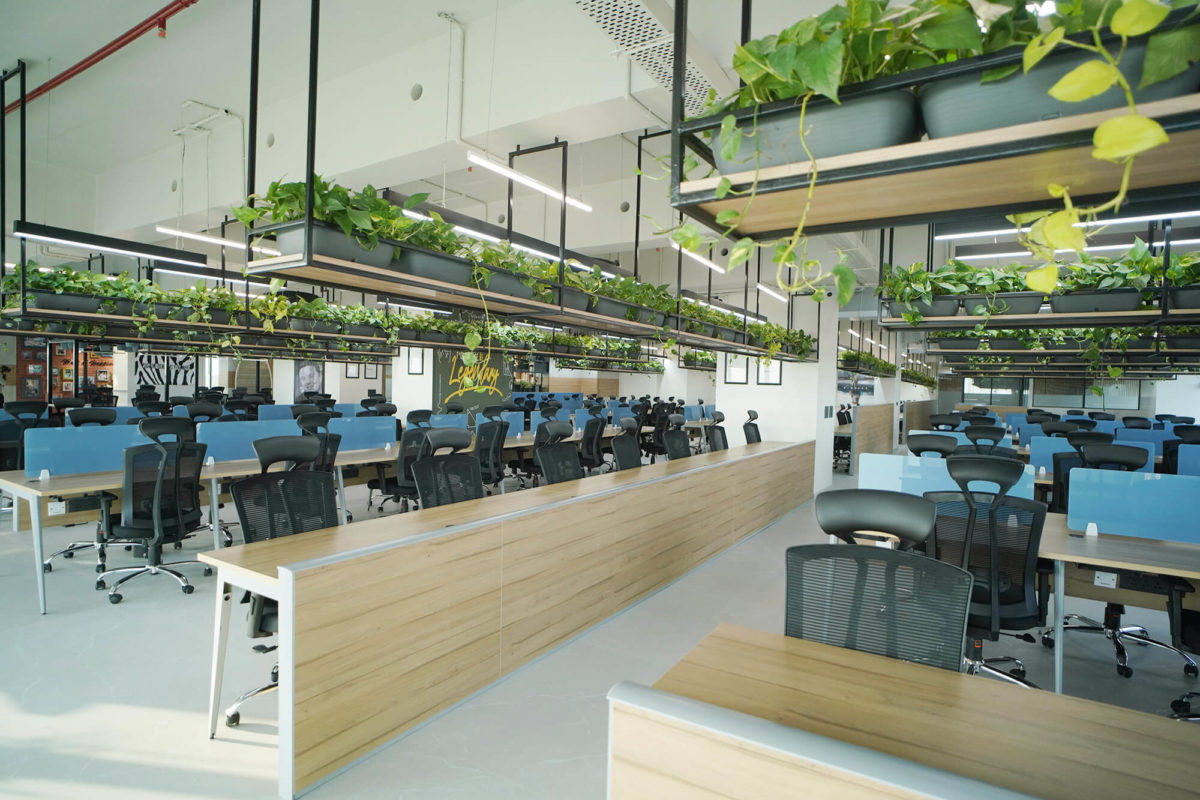 Open Floor Workstation Desks in the Middle center way to Cafeteria