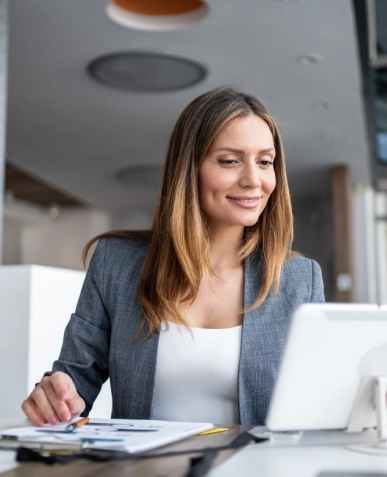 White label strategic and conversion-focused copy — professional focusing on screen with pen and notes on side for content planning