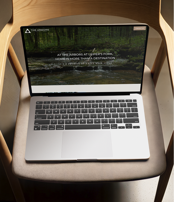 White label website builder design — laptop on chair displaying website layout