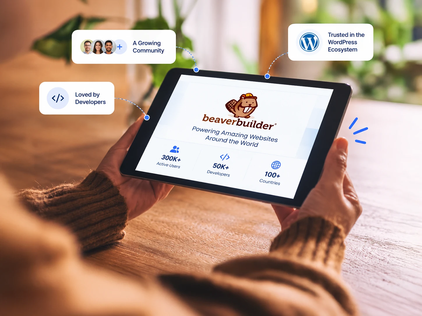 Beaver Builder platform trusted by WordPress users and developers worldwide. Hands holding a tablet showing Beaver Builder's global user community, trusted in the WordPress ecosystem and loved by developers